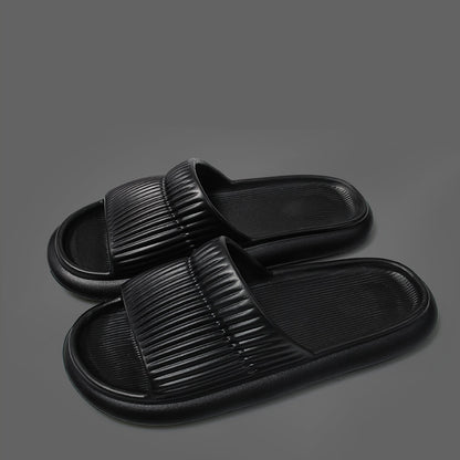 Black Arctic Nut Shower Slides with a striped EVA design.
