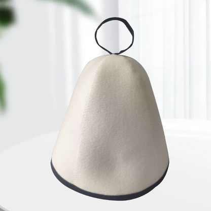 Supplier photo of the white felt Arctic Nut Banya Hat with black trim on a plain background