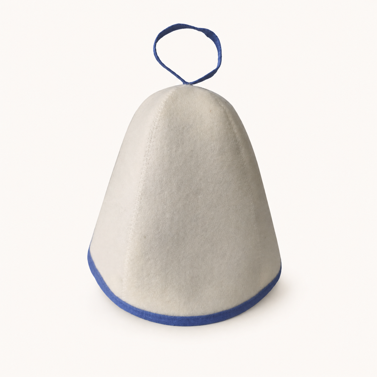 White felt Arctic Nut Banya Hat with blue trim on a plain warm-white background