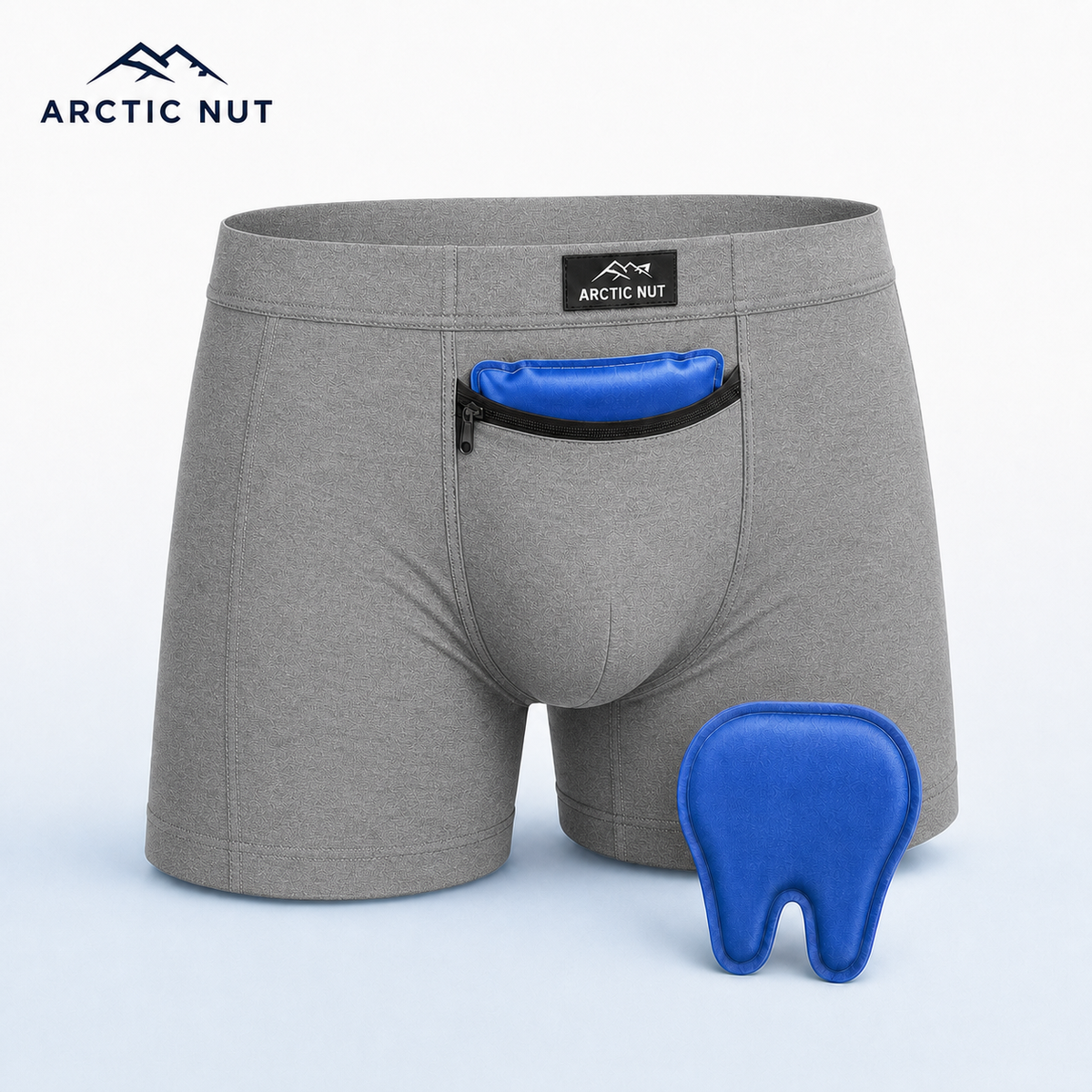 Arctic Nut Cooling Brief in Grey with one blue contoured gel pack in the zippered cooling pocket and a second reusable pack beside it.