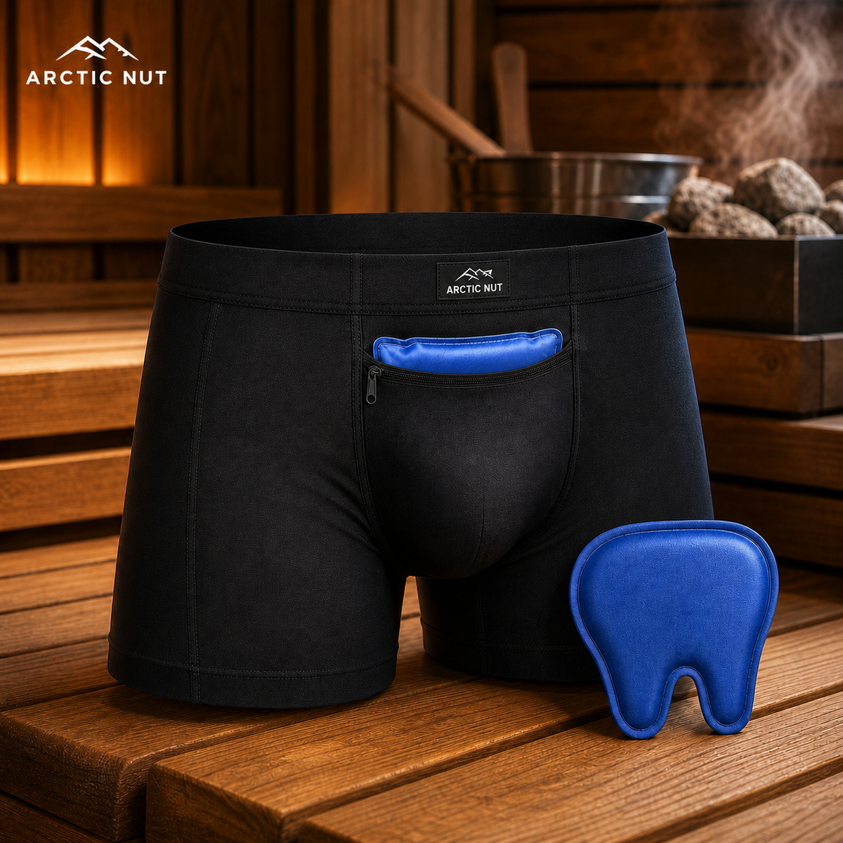Arctic Nut Cooling Brief in Black with two reusable gel packs displayed on a cedar sauna bench.