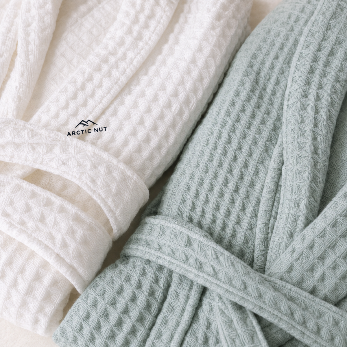 Close-up of White and Green waffle cloth with bound edges and Arctic Nut logo